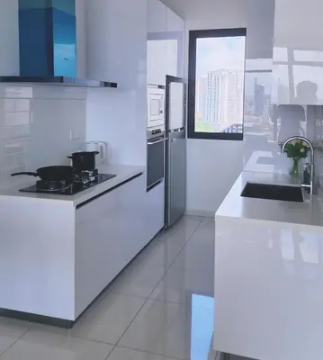 a white kitchen with a stove and a refrigerator at SkyPool with Seaview 8pax Beacon Executive Suites - Georgetown City Centre - 3km to Komtar in George Town