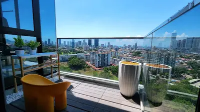 a balcony with a view of a city at SkyPool with Seaview 8pax Beacon Executive Suites - Georgetown City Centre - 3km to Komtar in George Town