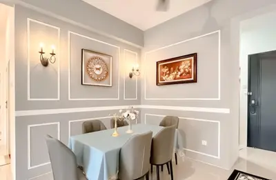 a dining room with a white table and chairs at Ipoh The Cove Hillside Stay 7 to 10 pax, 5 min to Ipoh Town in Ipoh
