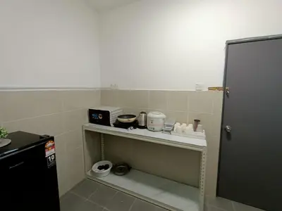 a kitchen with a shelf with a appliance on it at Dream4 @ emerald avenue in Brinchang