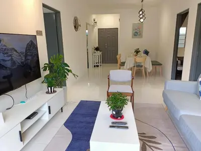 a living room with a couch and a tv at Dream4 @ emerald avenue in Brinchang