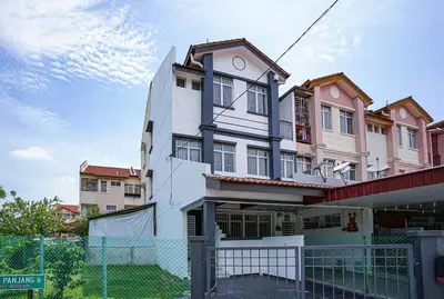 a white building with a fence in front of it at Jovial Modern Stylish Townhouse 8pax - BM Icon City in Bukit Mertajam