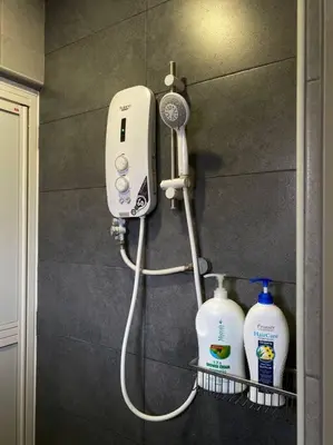 a bathroom with a blow dryer and two bottles of milk at Modern Stylish Double Storey 5Room 9Pax @Icon city in Bukit Mertajam