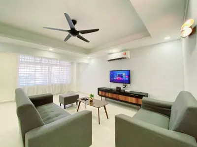 a living room with two couches and a ceiling fan at Modern Stylish Double Storey 5Room 9Pax @Icon city in Bukit Mertajam