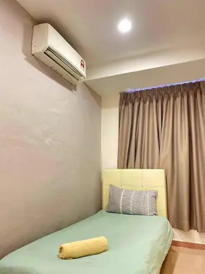 a bedroom with a bed and a air conditioner at Modern Stylish Double Storey 5Room 9Pax @Icon city in Bukit Mertajam