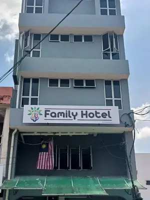 a building with a sign for a family hotel at FAMILY HOTEL in Kuala Kubu Baharu