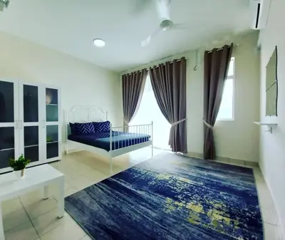 a living room with a bed and a large window at Rumah Singgah Bagan Serai Perak in Bagan Serai