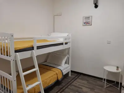 a room with a bunk bed and a ladder at G FORTUNE GUEST HOUSE+ in George Town