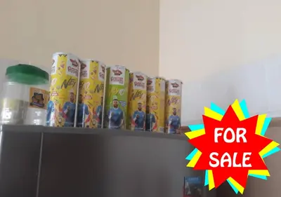 a shelf with toys and a for sale sign on it at Homestay Cikgu Mokhsin (Muslim) in Kuala Kangsar