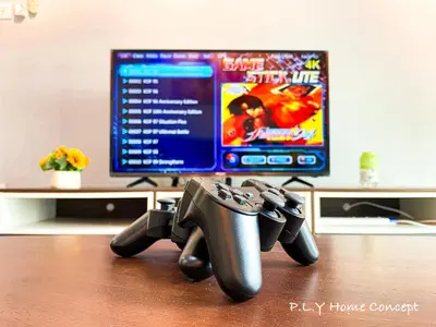 a video game controller sitting on a desk with a computer monitor at Groundfloor Poolside Manhattan Ipoh Free Netflix&Carpark in Ipoh