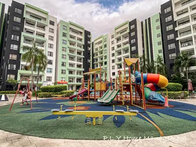 a playground in front of a large building at Groundfloor Poolside Manhattan Ipoh Free Netflix&Carpark in Ipoh
