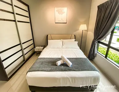 a small bedroom with a bed and a window at Groundfloor Poolside Manhattan Ipoh Free Netflix&Carpark in Ipoh