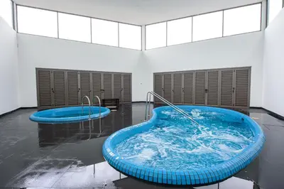 a large blue bath tub in a room at Serene Mossy Family Cottage(2-7pax) 10 Min to BOH in Cameron Highlands