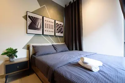 a bedroom with a bed with a white towel on it at Serene Mossy Family Cottage(2-7pax) 10 Min to BOH in Cameron Highlands