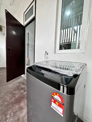 a kitchen with a counter with a mirror on it at Queen’s Villa for 28Pax @Central of Penang in Jelutong