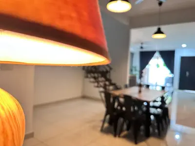 a dining room with a table and some chairs at Queen’s Villa for 28Pax @Central of Penang in Jelutong