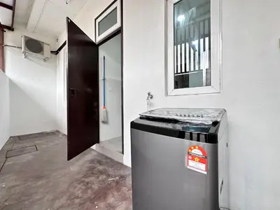 a bathroom with a trash can in a room at Queen’s Villa for 28Pax @Central of Penang in Jelutong