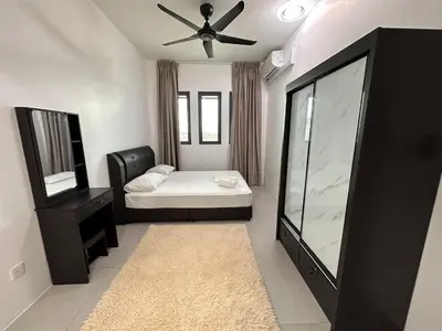 a bedroom with a bed and a dresser and a mirror at SZ Home Legacy at Meritus in Perai