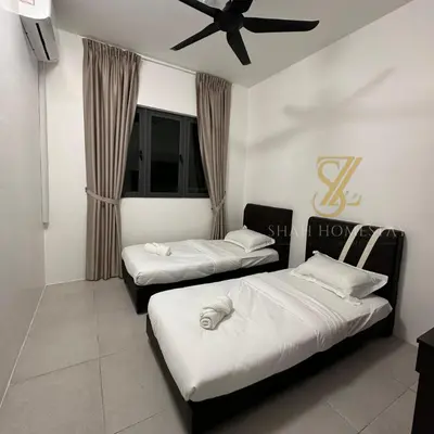 two beds in a room with a ceiling fan at SZ Home Legacy at Meritus in Perai