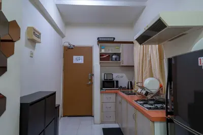 a small kitchen with a sink and a stove at Jemhaus Studio Sunset Seaview [Netflix & Cuckoo] in Lumut