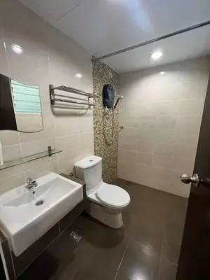 a bathroom with a white toilet and a sink at D'Sea Marina Island Resort by Manhattan Group in Lumut