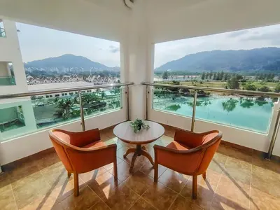 a room with a table and chairs and a large window at D'Sea Marina Island Resort by Manhattan Group in Lumut