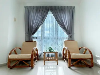 two chairs and a table in front of a window at D'Sea Marina Island Resort by Manhattan Group in Lumut