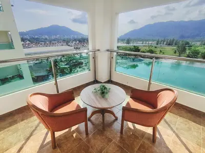 a room with a table and two chairs and a large window at D'Sea Marina Island Resort by Manhattan Group in Lumut