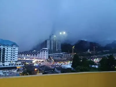 a view of a city at night with buildings at Emerald New Homstay in Brinchang