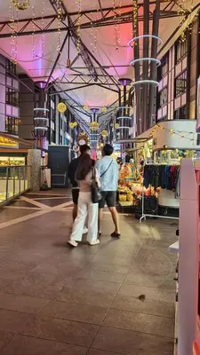a group of people walking in a shopping mall at Emerald New Homstay in Brinchang