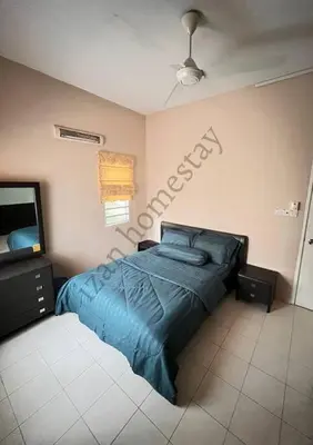 a bedroom with a blue bed and a tv at Anoi Homestay TAMBUN @ Lost World HighSpeed WiFi in Tambun