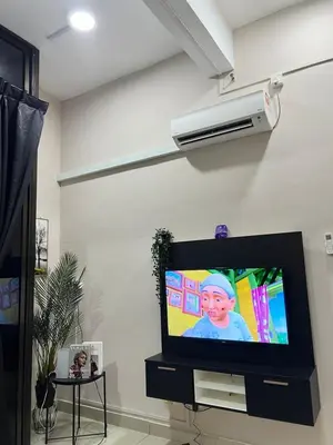 a flat screen tv sitting in a living room at GR studio APARTMENT 1 - kompleks MUTIARA gua MUSANG in Gua Musang