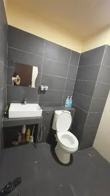a bathroom with a toilet and a sink at GR studio APARTMENT 1 - kompleks MUTIARA gua MUSANG in Gua Musang