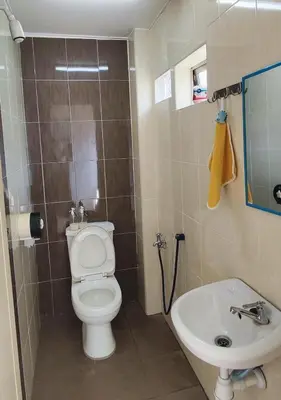 a bathroom with a toilet and a sink at Minimaliste Ipoh Garden 2 minute to stadium 5BR5BR in Ipoh