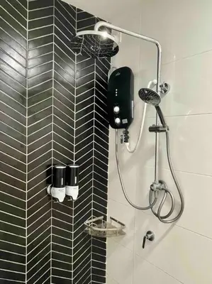 a bathroom with a shower with black and white tiles at The Horizon @ Ipoh - Cozy Condo with Balcony Patio in Ipoh