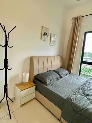a small bedroom with a bed and a window at The Horizon @ Ipoh - Cozy Condo with Balcony Patio in Ipoh