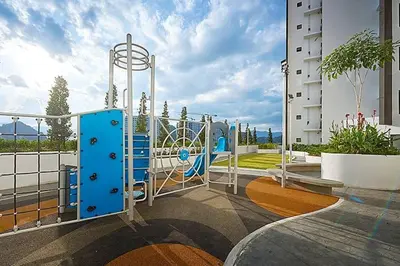 a playground in front of a building at The Horizon @ Ipoh - Cozy Condo with Balcony Patio in Ipoh