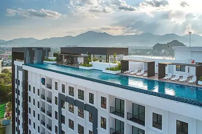 a view of a building with a swimming pool at The Horizon @ Ipoh - Cozy Condo with Balcony Patio in Ipoh