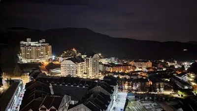a view of a city at night with buildings at Brinchang Cameron Highlands Homstay in Brinchang