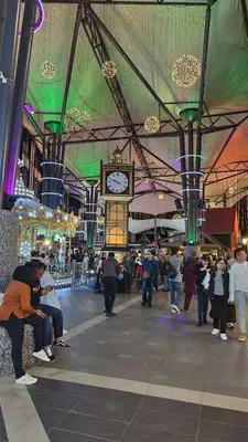 a group of people in a building with a clock at Brinchang Cameron Highlands Homstay in Brinchang