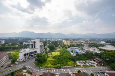an aerial view of a city with mountains in the background at Cosy City-View Suite in Town in Ipoh