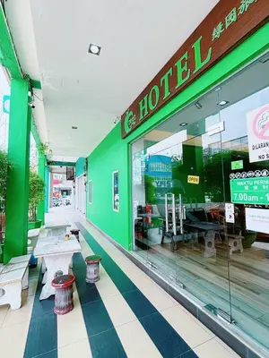 a fast food restaurant with a green wall at Asia Green Hotel in Sungai Besar