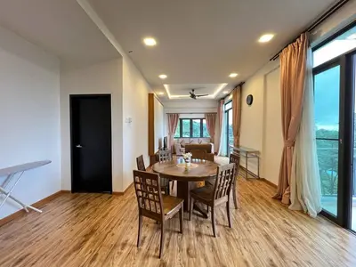 a dining room with a table and chairs at Delisha Homestay 3R2B The Retreat,Aranda Nova in Brinchang