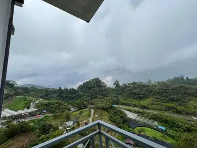 a view of a mountain from a balcony at Delisha Homestay 3R2B The Retreat,Aranda Nova in Brinchang