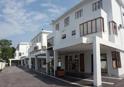 a white building with a lot of windows at White House Homestay in Ipoh