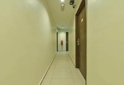 a long hallway with at M Three Hotel in Kampong Batu Tiga