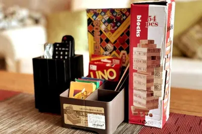 a box of legos sitting on a table next to a box of monopoly at Straits Quay Highest & Spacious Seaview Suite - 2 in Tanjong Tokong