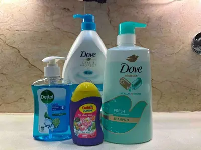 three bottles of cleaning products sitting on a bathroom counter at Straits Quay Highest & Spacious Seaview Suite - 2 in Tanjong Tokong