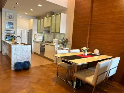 a kitchen and dining room with a table and chairs at Straits Quay Highest & Spacious Seaview Suite - 2 in Tanjong Tokong