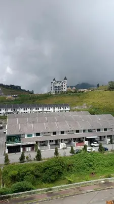 a large building with rows of solar panels on it at Sweet Homestay 3RM @ Penthouse Apartment in Brinchang in Brinchang